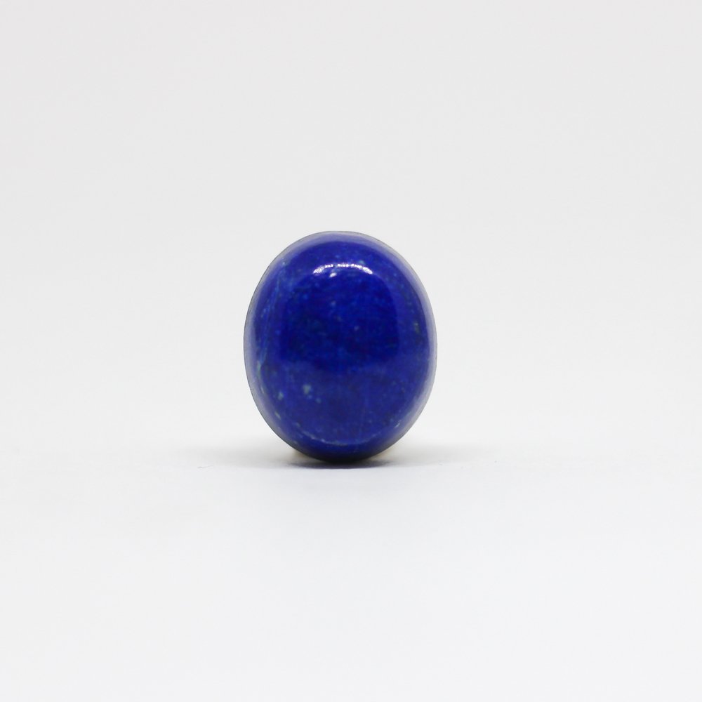 A close-up of a Natural Lapis Lazuli gemstone featuring deep blue hues with golden pyrite inclusions.