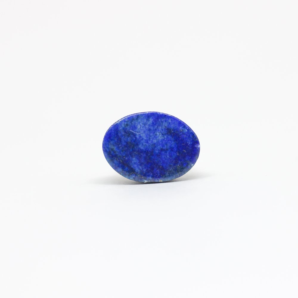 A close-up of a Natural Lapis Lazuli gemstone featuring deep blue hues with golden pyrite inclusions.