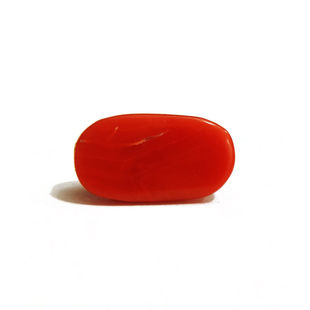 A close-up of a Natural Italian Red Coral gemstone featuring its deep red hue and smooth texture.