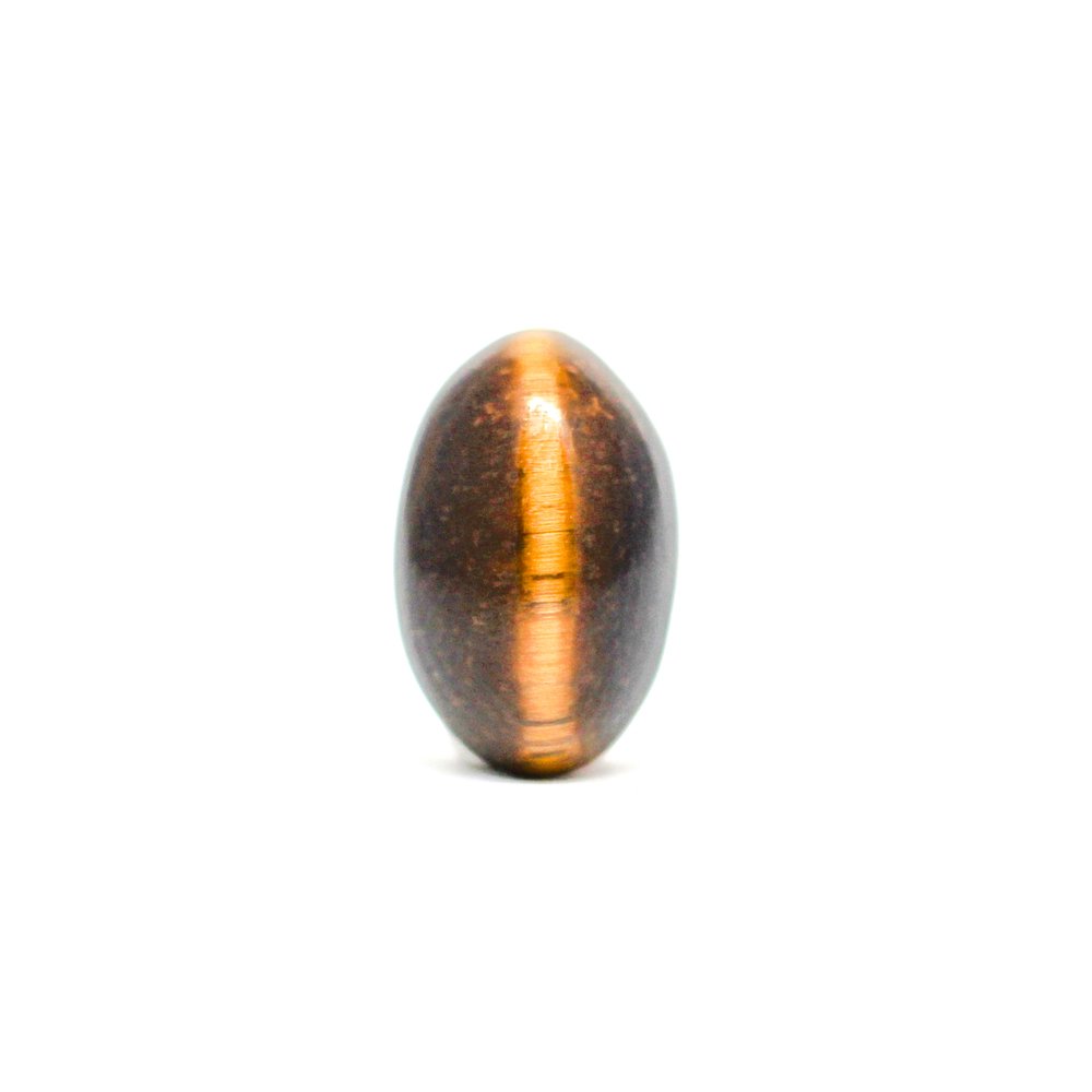 A close-up of a Natural Tiger Eye gemstone showcasing its golden-brown hues and chatoyant effect.