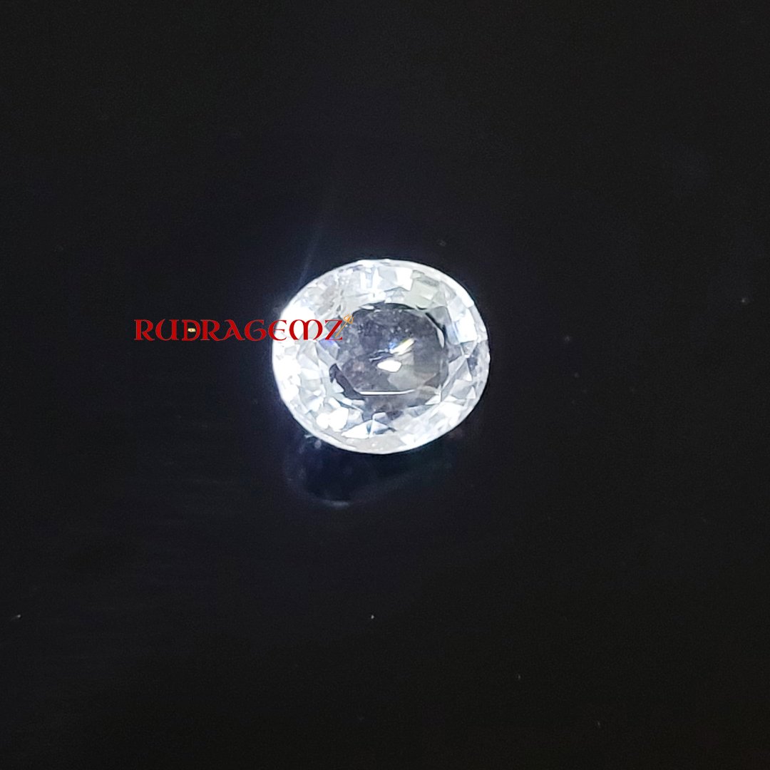 A polished White Topaz stone, known for its purity, positive energy, and astrological significance.