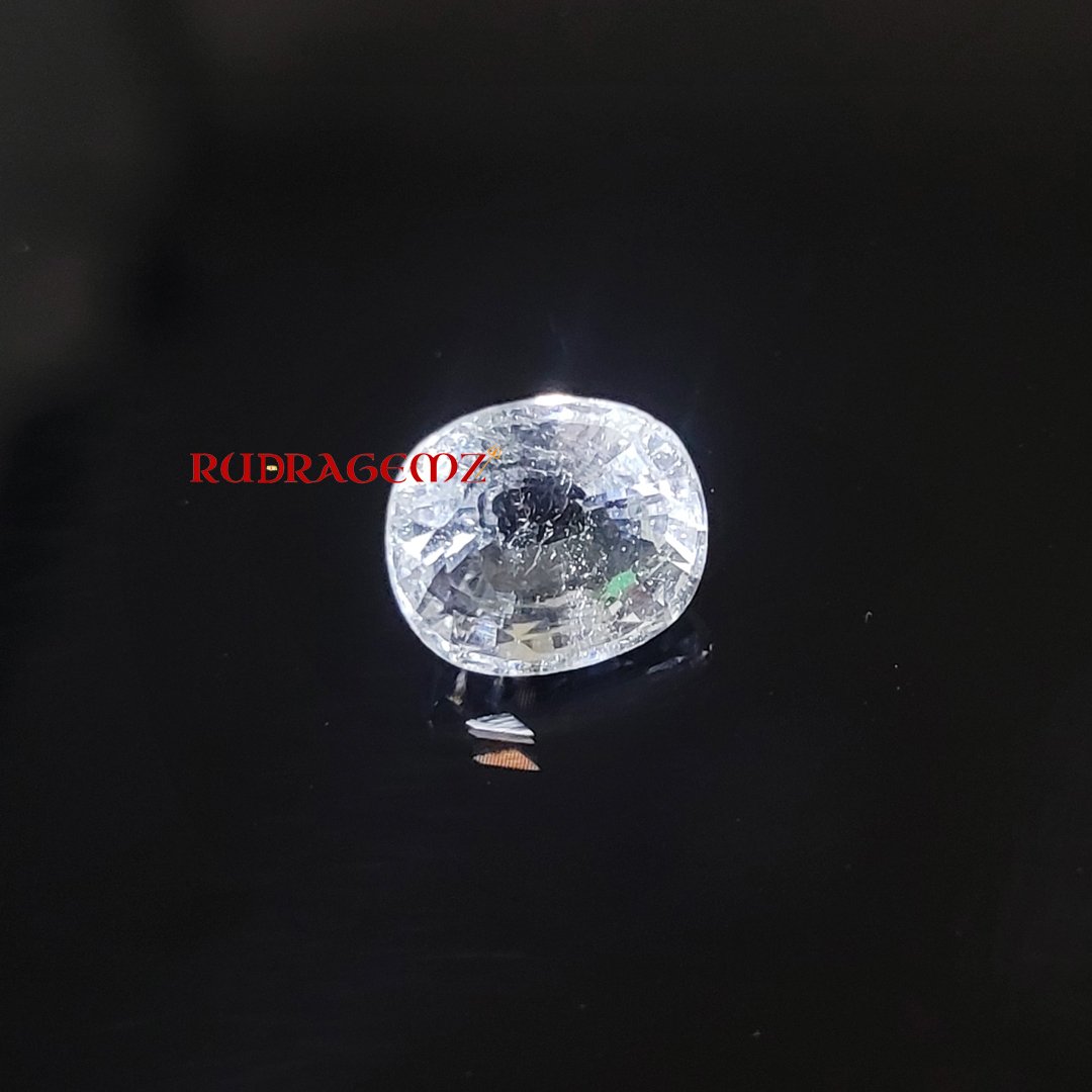 A polished White Topaz stone, known for its purity, positive energy, and astrological significance.