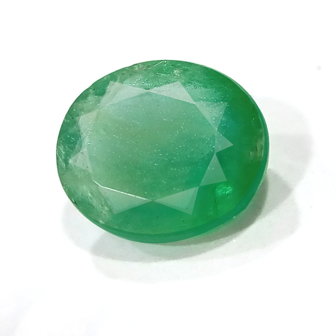 "Close-up of a radiant Zambian Emerald showcasing its vibrant green color and faceted cut."