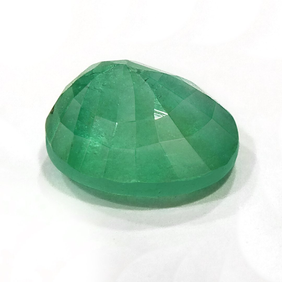 "Close-up of a radiant Zambian Emerald showcasing its vibrant green color and faceted cut."