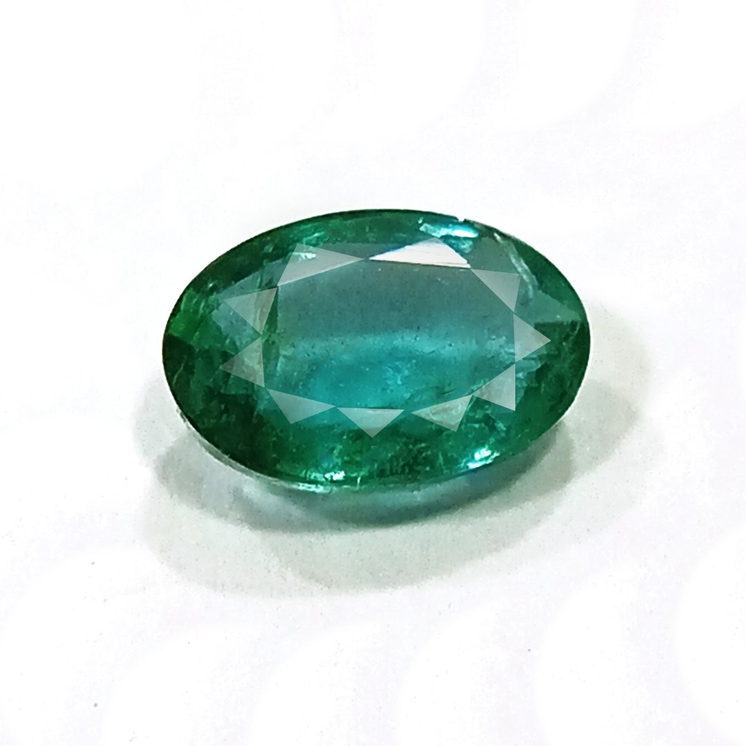 "Close-up of a radiant Zambian Emerald showcasing its vibrant green color and faceted cut."