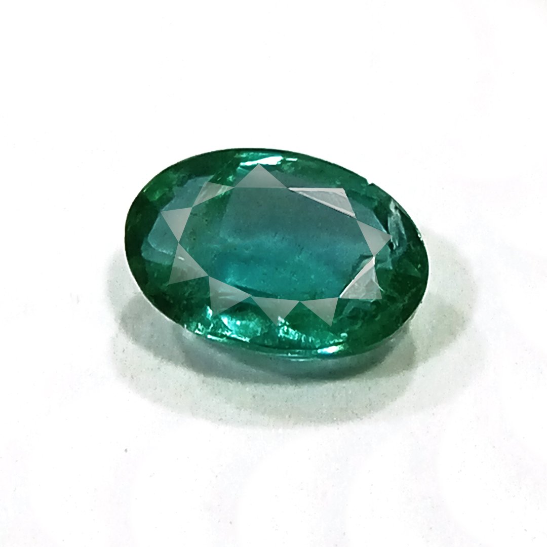 "Close-up of a radiant Zambian Emerald showcasing its vibrant green color and faceted cut."
