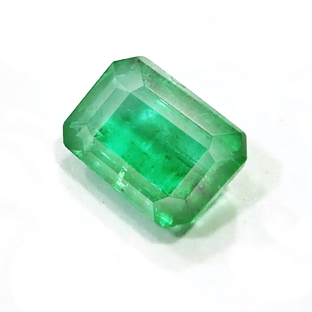 "Close-up of a radiant Zambian Emerald showcasing its vibrant green color and faceted cut."