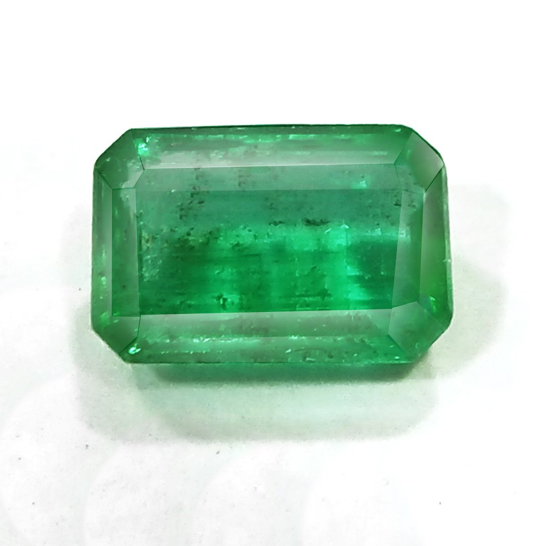 "Close-up of a radiant Zambian Emerald showcasing its vibrant green color and faceted cut."
