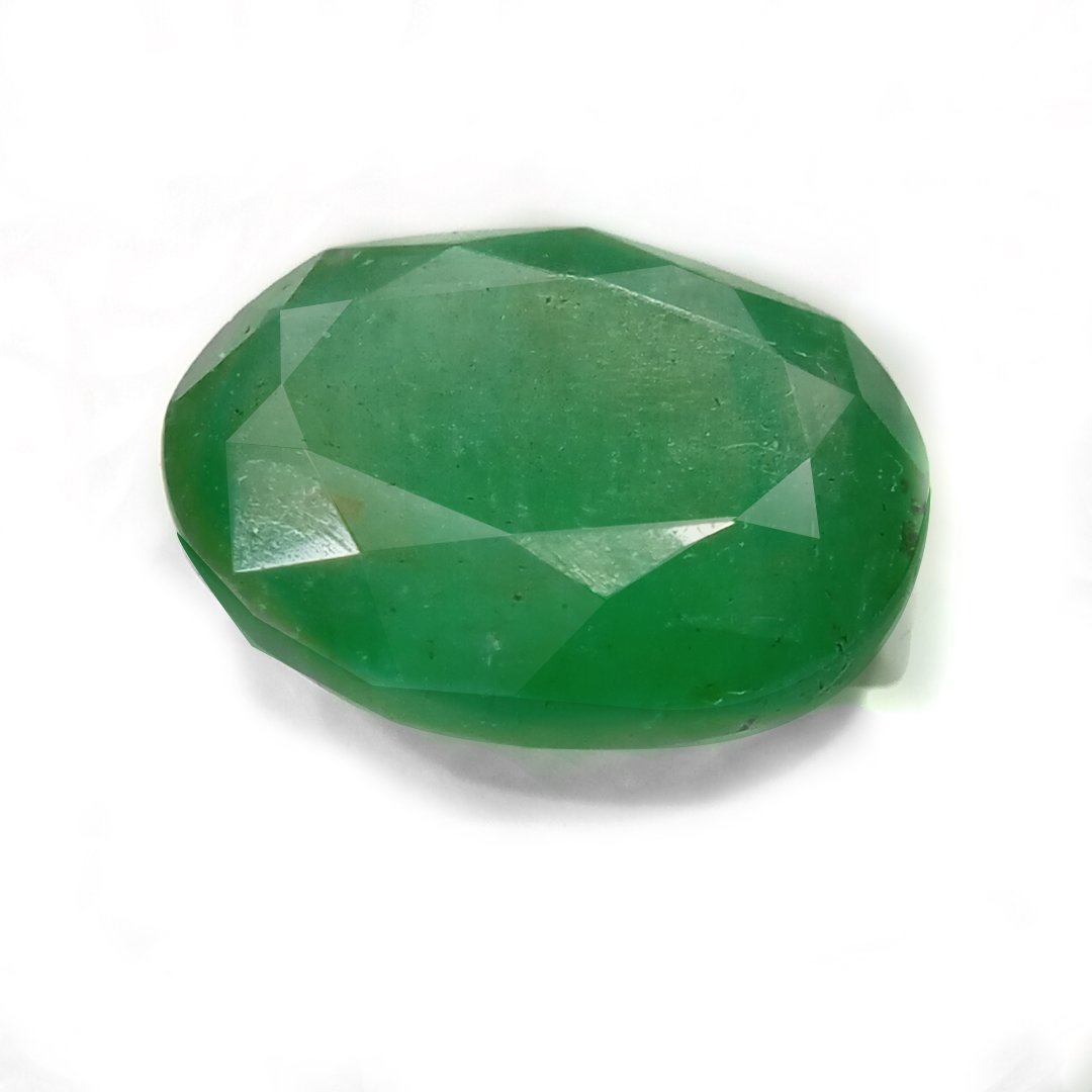 "Close-up of a radiant Zambian Emerald showcasing its vibrant green color and faceted cut."
