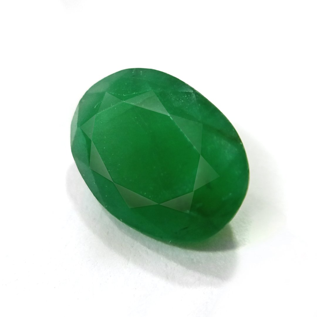 "Close-up of a radiant Zambian Emerald showcasing its vibrant green color and faceted cut."
