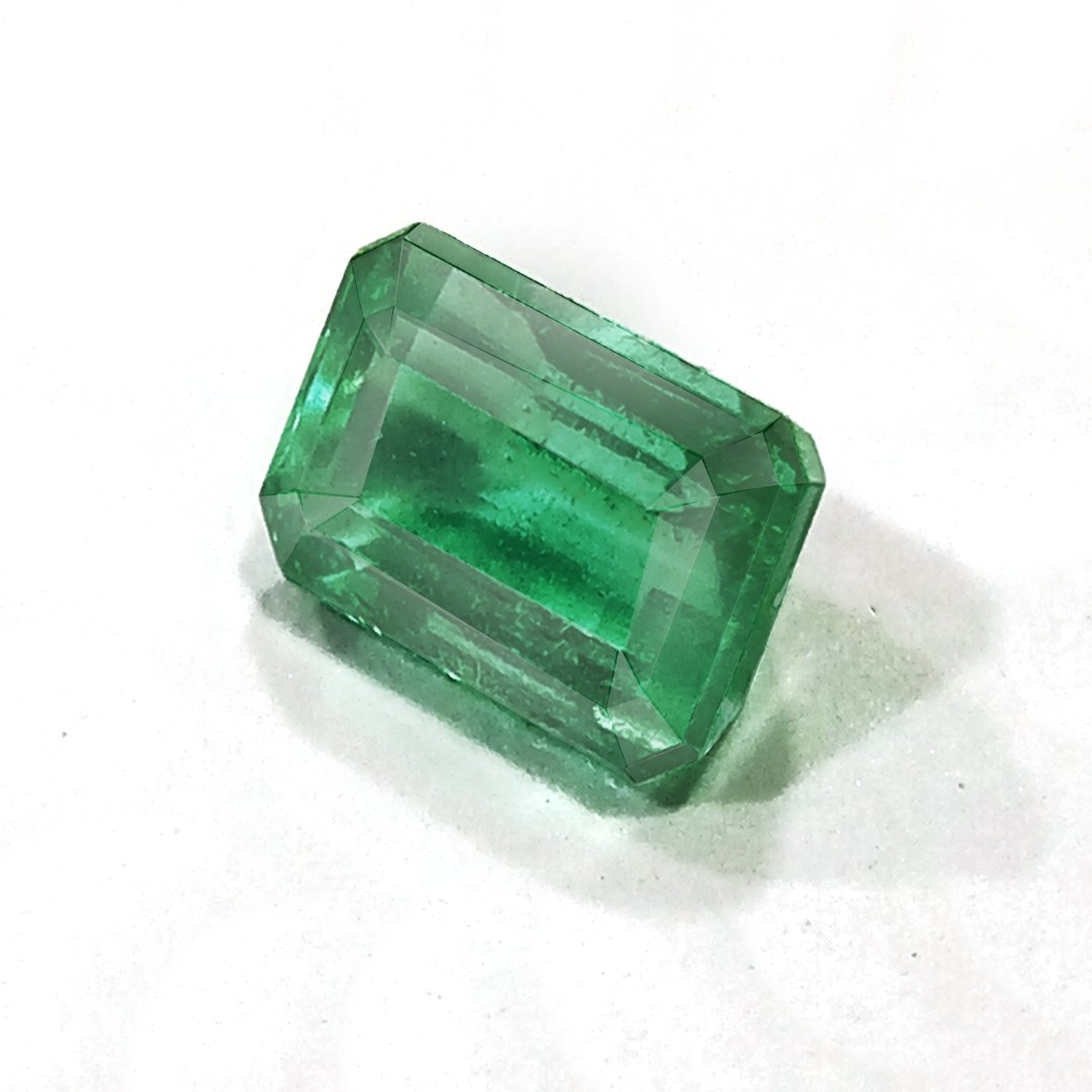 "Close-up of a radiant Zambian Emerald showcasing its vibrant green color and faceted cut."
