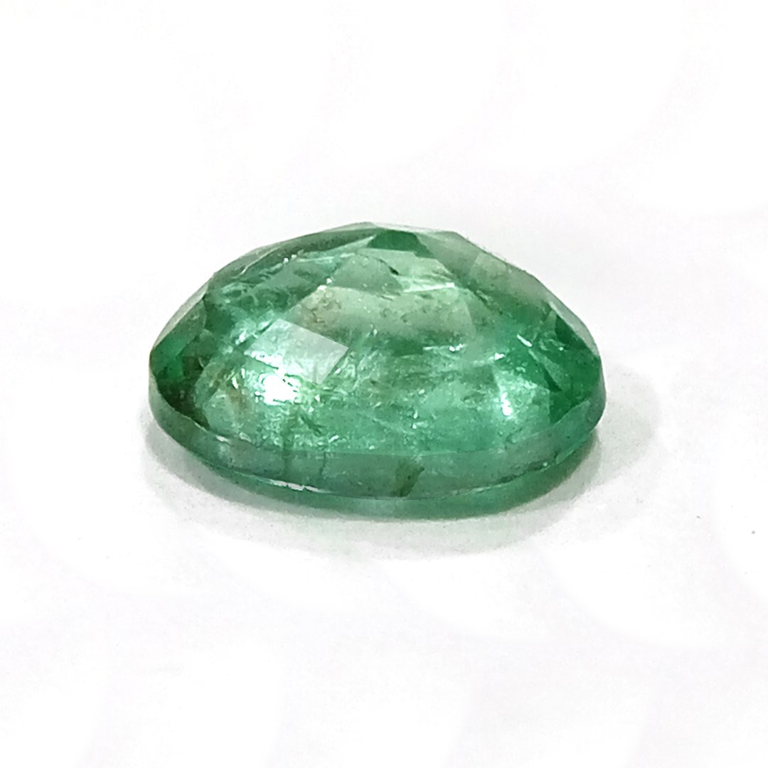 "Close-up of a radiant Zambian Emerald showcasing its vibrant green color and faceted cut."