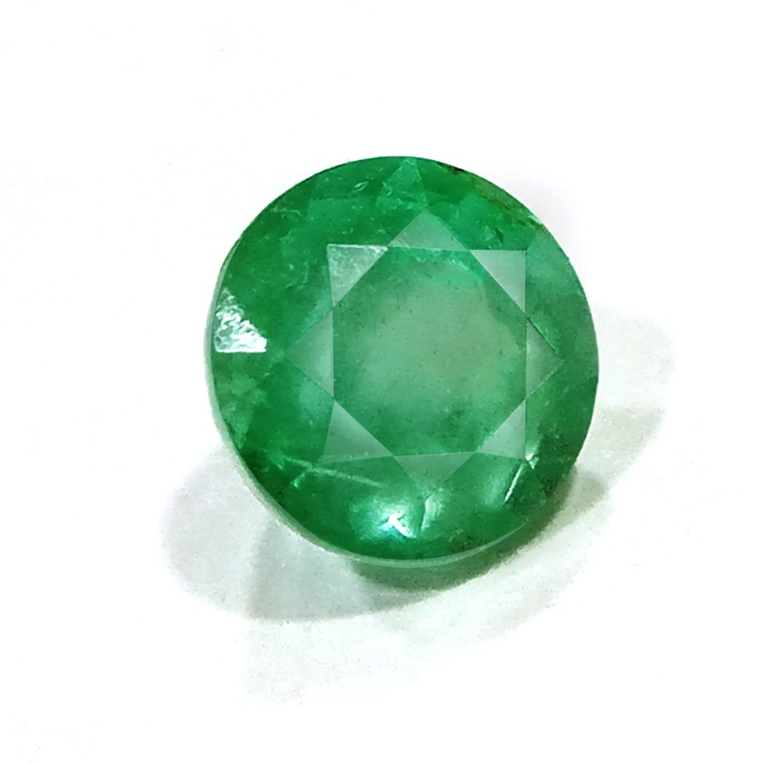 "Close-up of a radiant Zambian Emerald showcasing its vibrant green color and faceted cut."