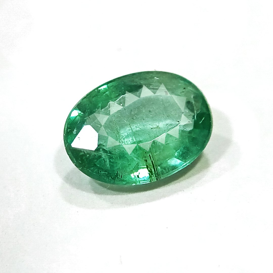 "Close-up of a radiant Zambian Emerald showcasing its vibrant green color and faceted cut."