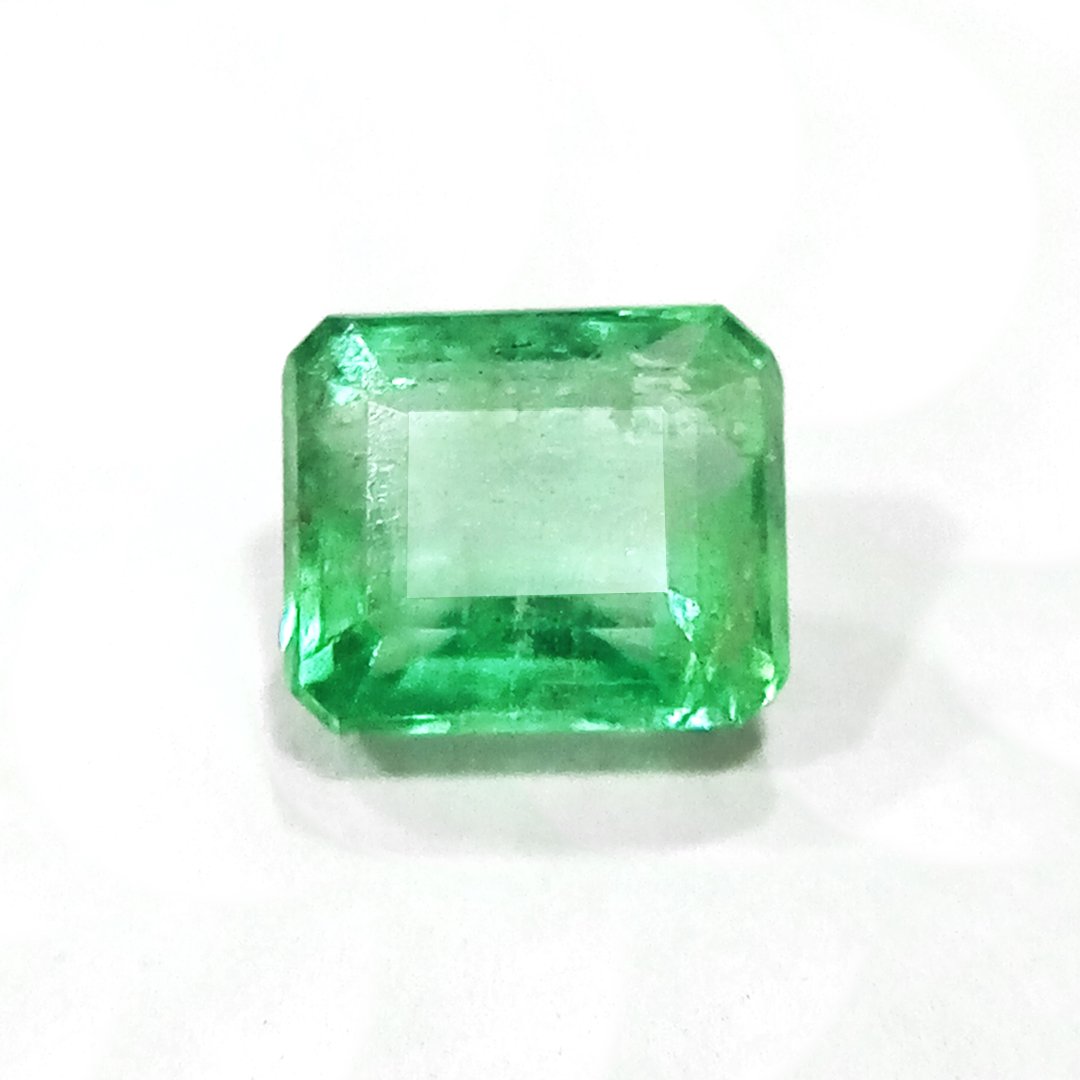 "Close-up of a radiant Zambian Emerald showcasing its vibrant green color and faceted cut."