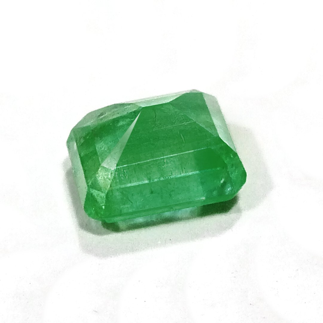 "Close-up of a radiant Zambian Emerald showcasing its vibrant green color and faceted cut."