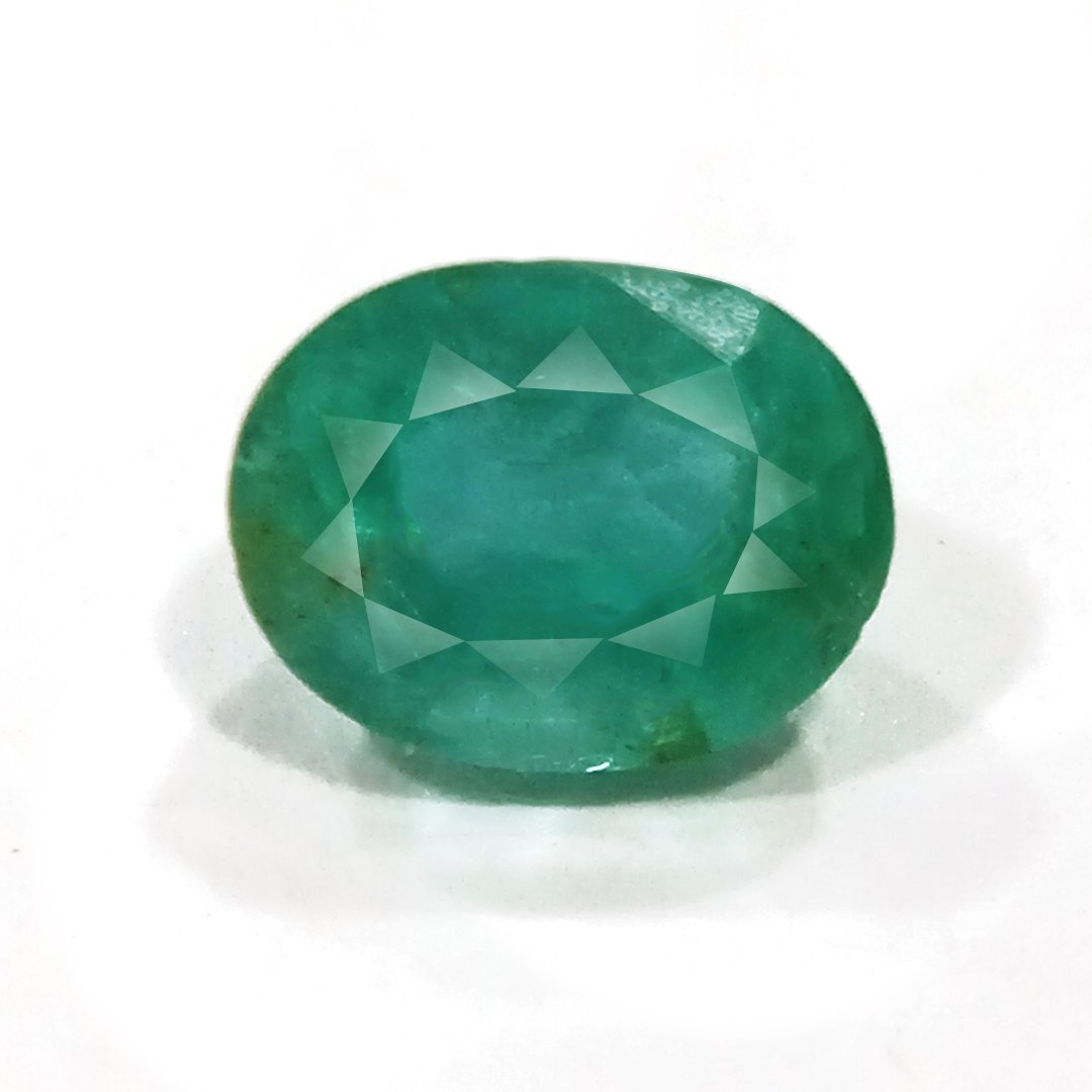 "Close-up of a radiant Zambian Emerald showcasing its vibrant green color and faceted cut."