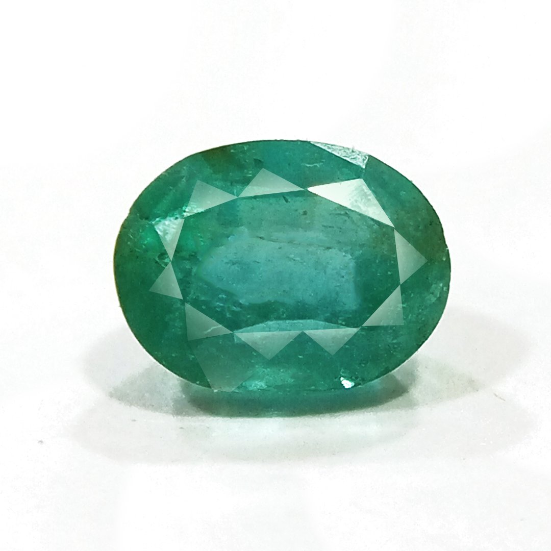 "Close-up of a radiant Zambian Emerald showcasing its vibrant green color and faceted cut."