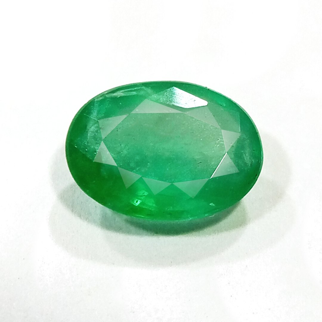 "Close-up of a radiant Zambian Emerald showcasing its vibrant green color and faceted cut."