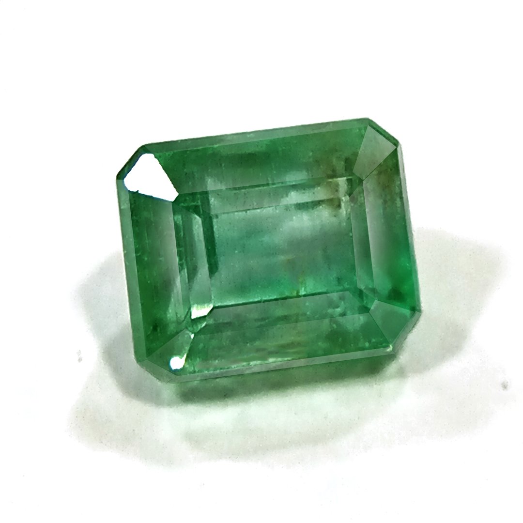 "Close-up of a radiant Zambian Emerald showcasing its vibrant green color and faceted cut."