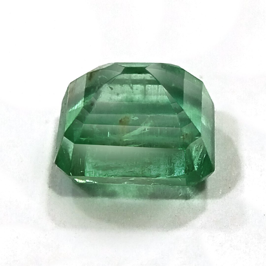 "Close-up of a radiant Zambian Emerald showcasing its vibrant green color and faceted cut."