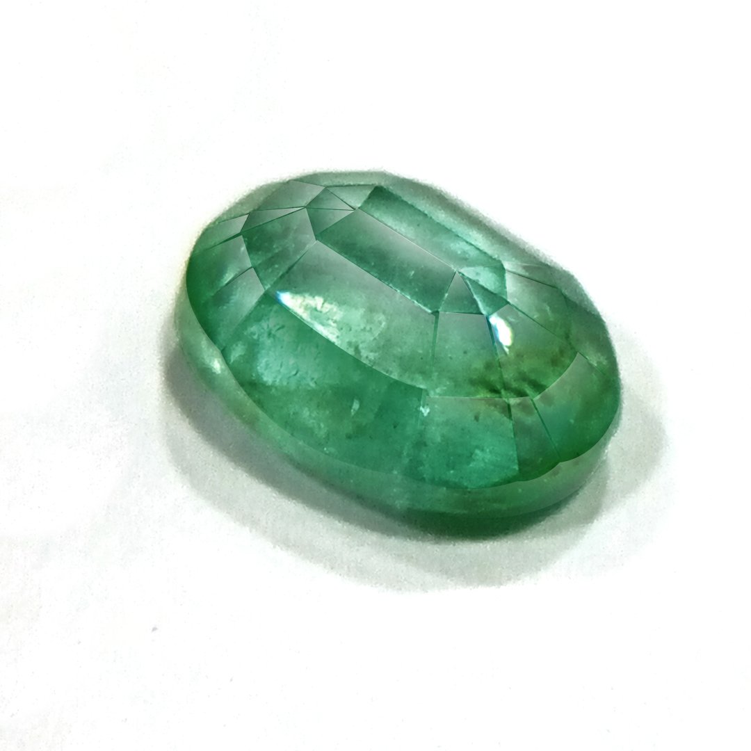 "Close-up of a radiant Zambian Emerald showcasing its vibrant green color and faceted cut."