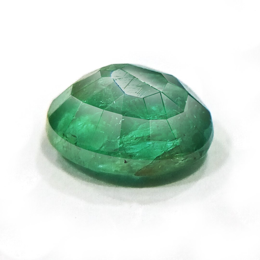 "Close-up of a radiant Zambian Emerald showcasing its vibrant green color and faceted cut."