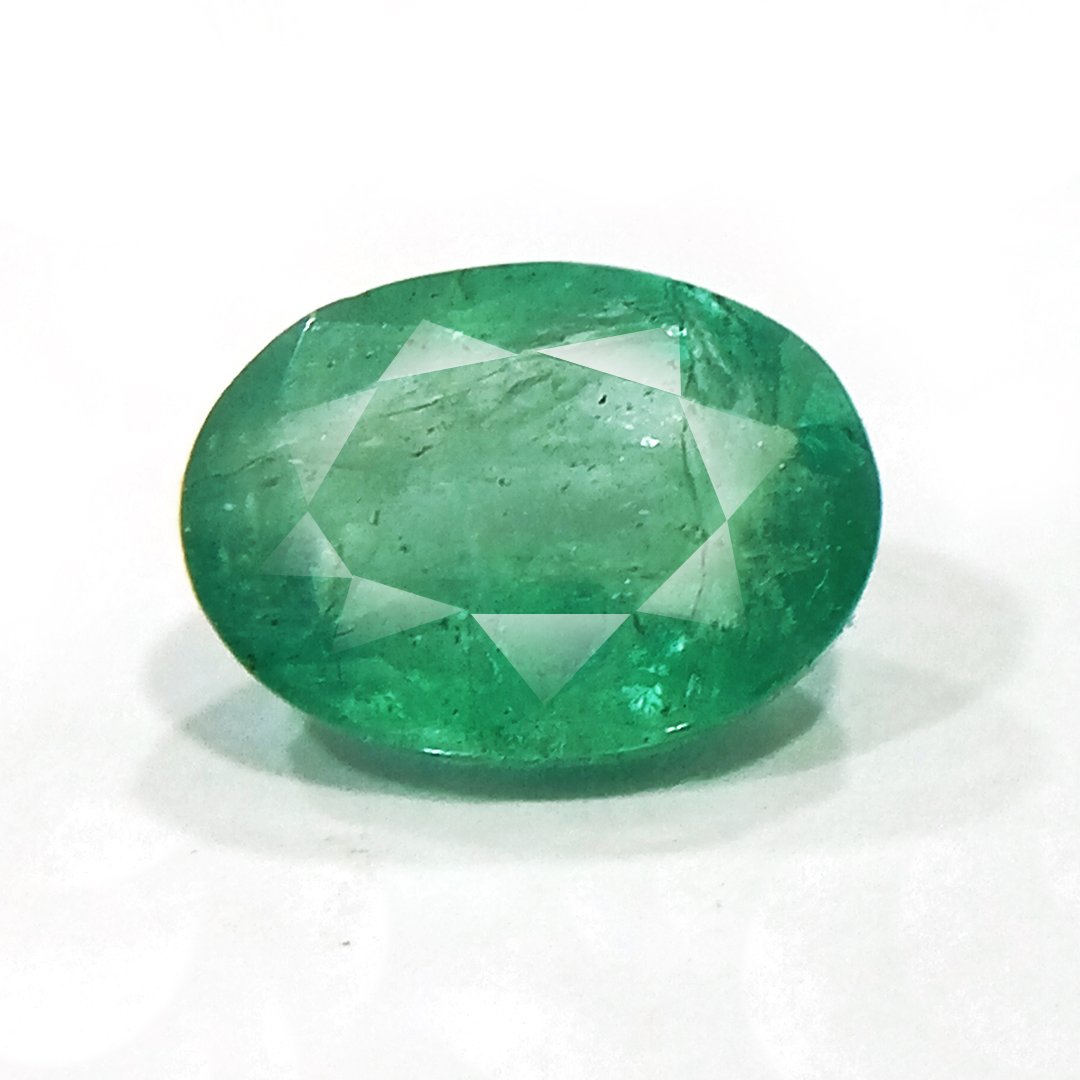 "Close-up of a radiant Zambian Emerald showcasing its vibrant green color and faceted cut."
