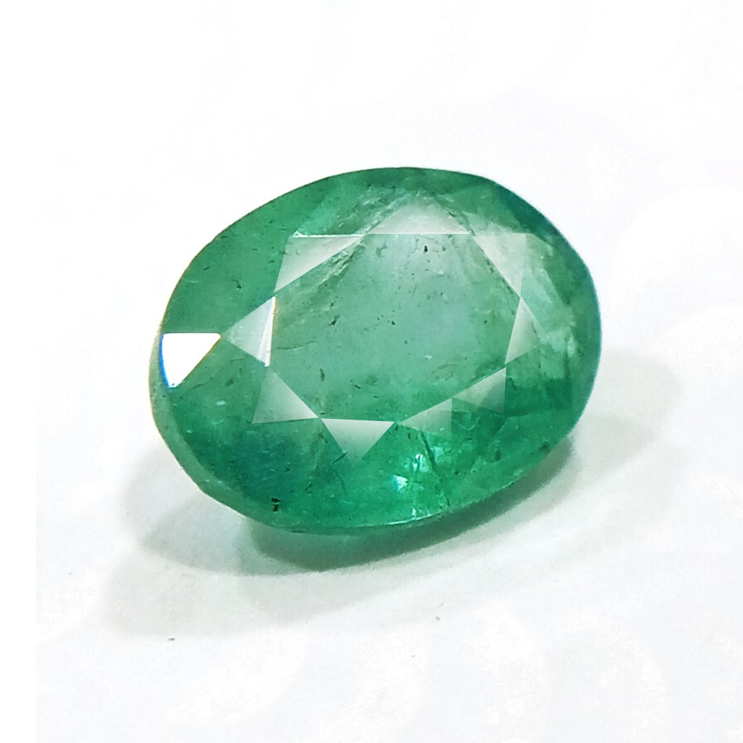 "Close-up of a radiant Zambian Emerald showcasing its vibrant green color and faceted cut."