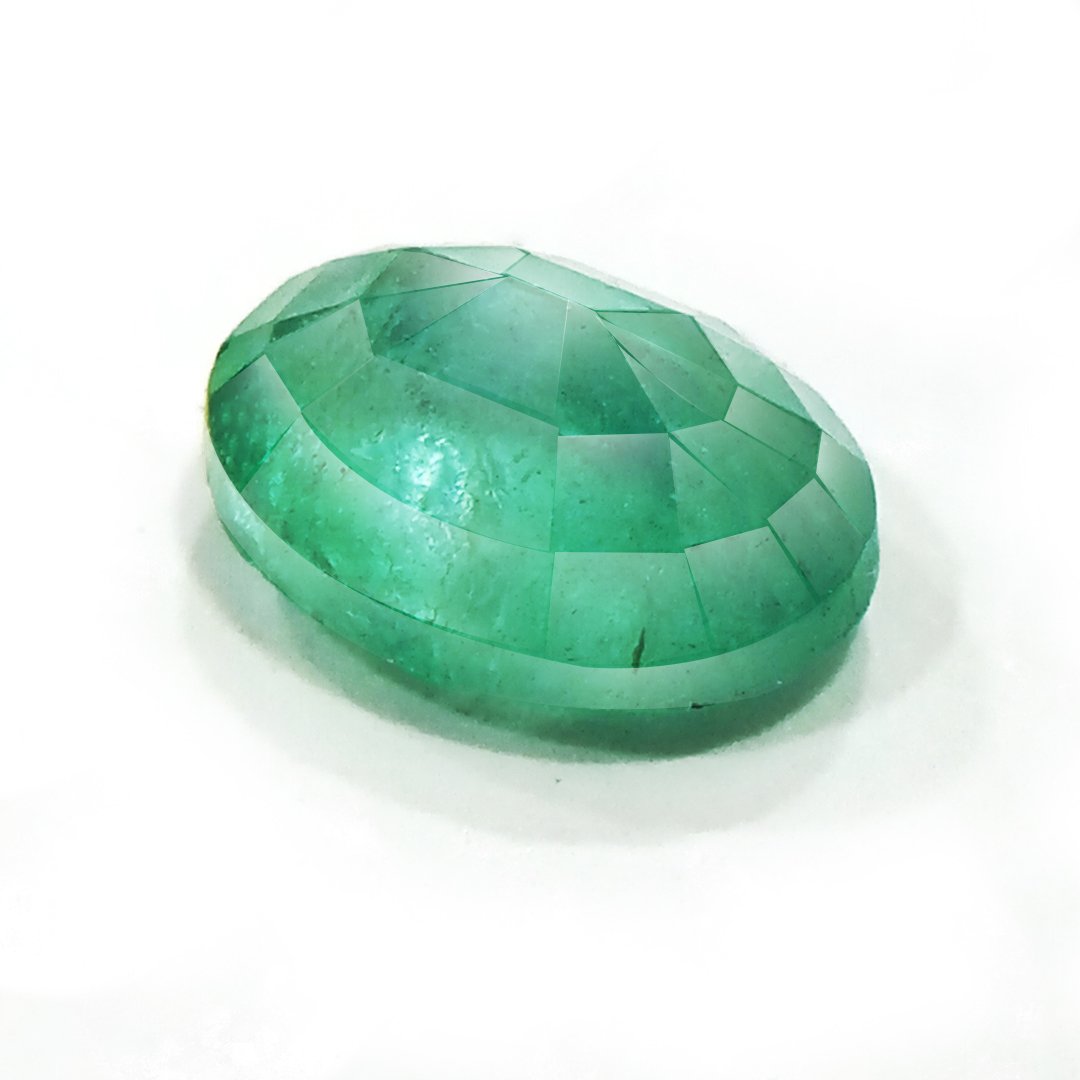 "Close-up of a radiant Zambian Emerald showcasing its vibrant green color and faceted cut."