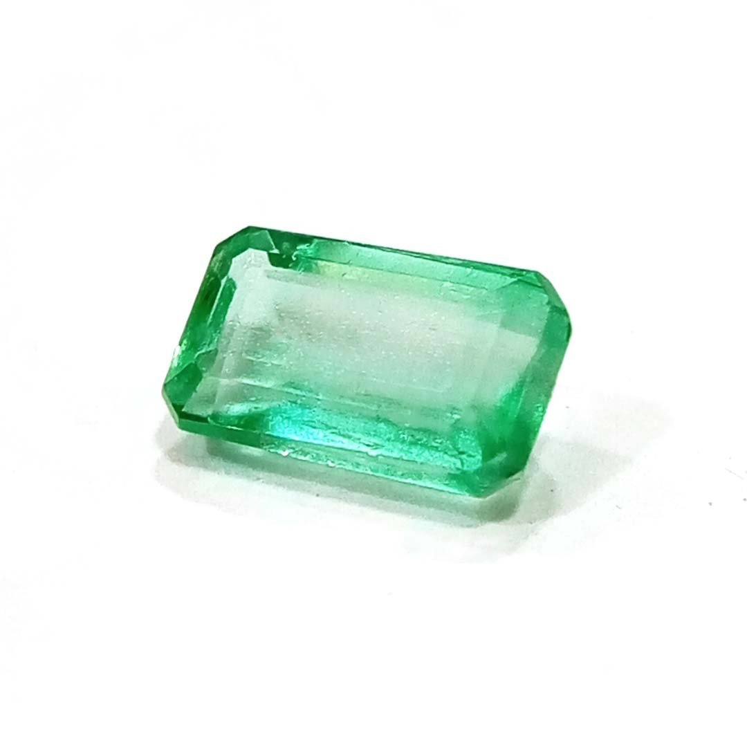 "Close-up of a radiant Zambian Emerald showcasing its vibrant green color and faceted cut."