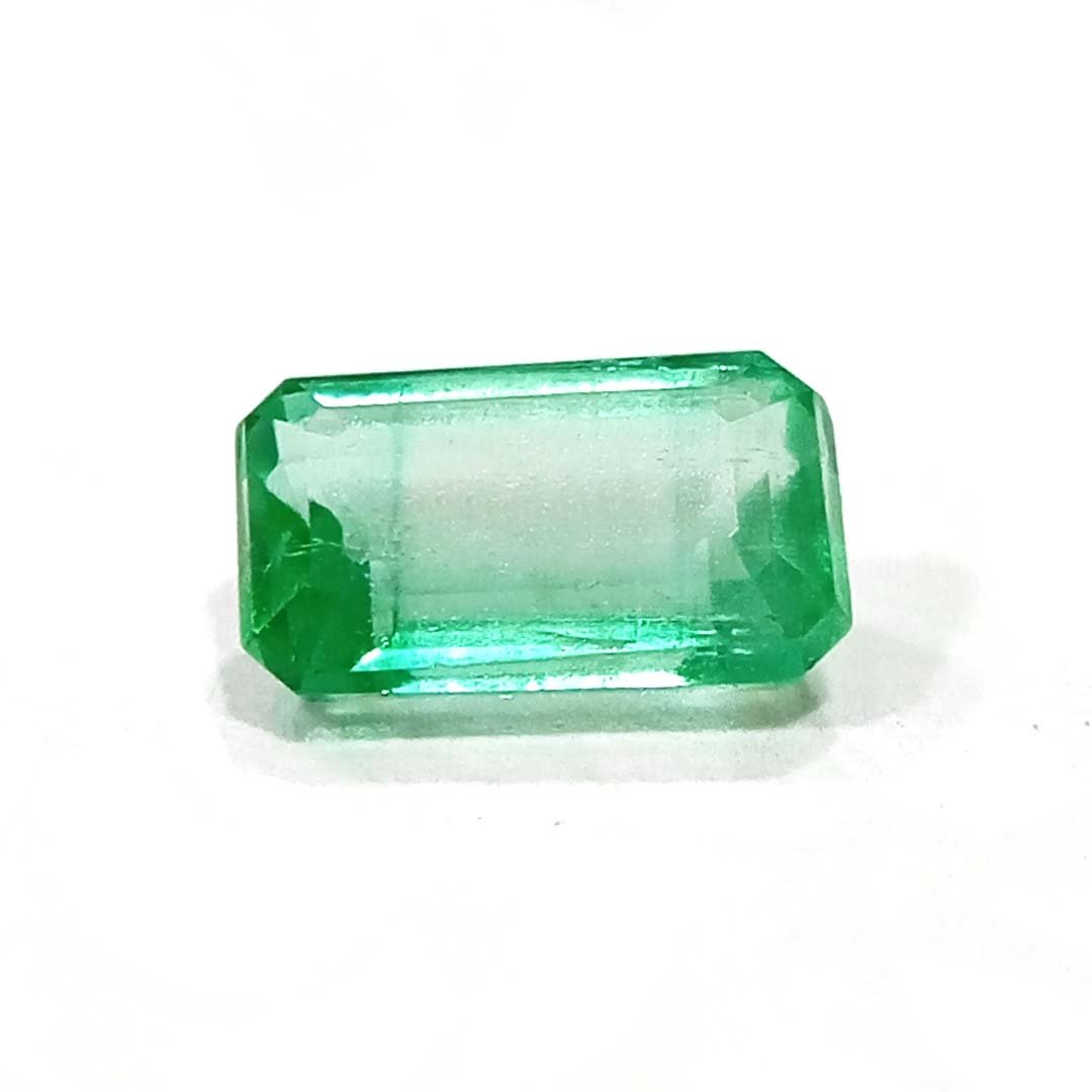"Close-up of a radiant Zambian Emerald showcasing its vibrant green color and faceted cut."