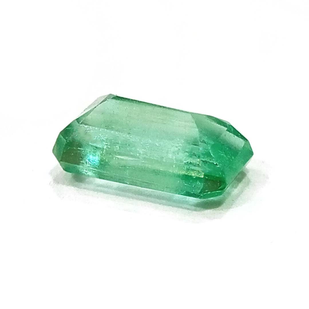 "Close-up of a radiant Zambian Emerald showcasing its vibrant green color and faceted cut."