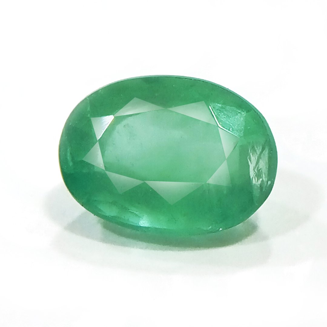 "Close-up of a radiant Zambian Emerald showcasing its vibrant green color and faceted cut."