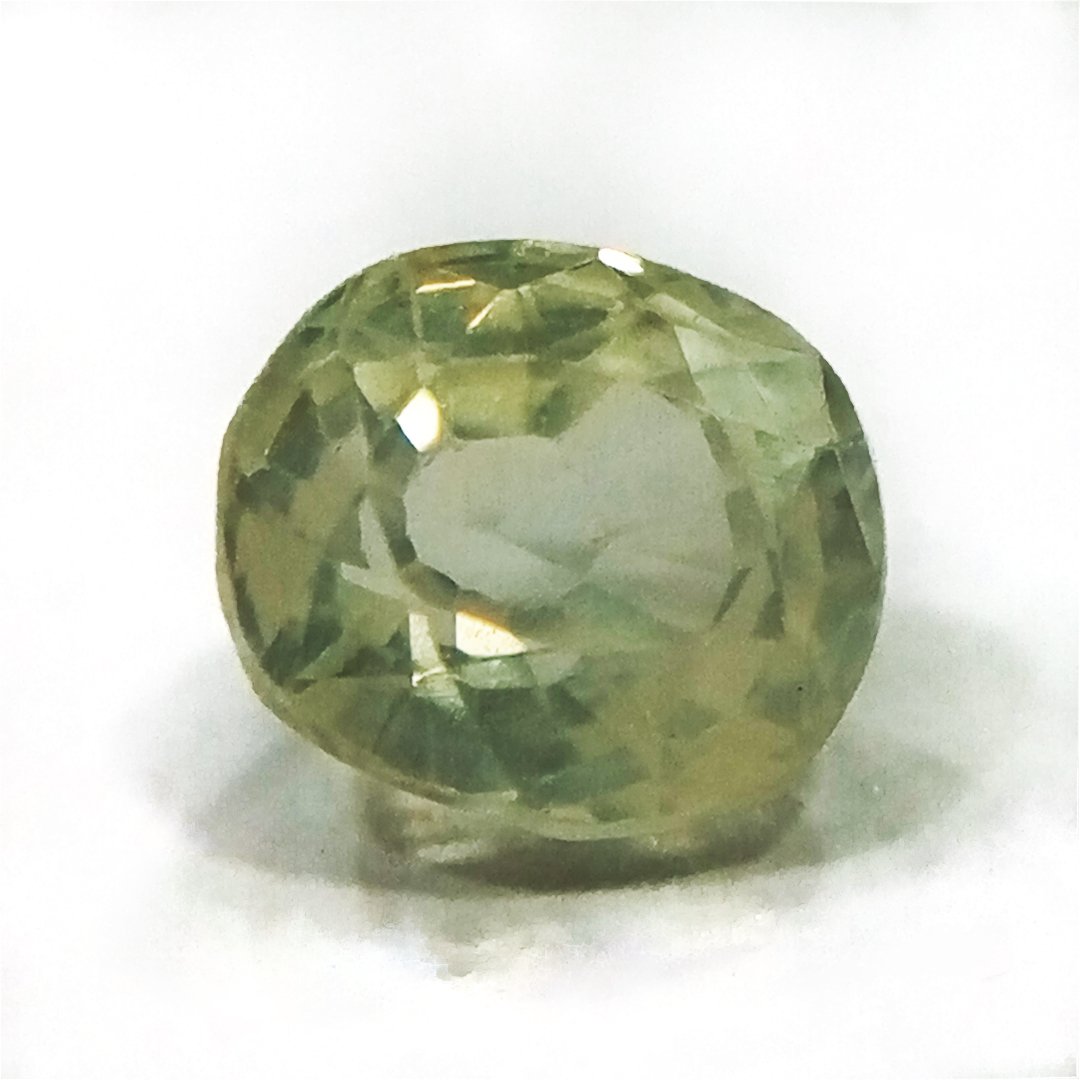 A high-quality Yellow Sapphire stone, known for its astrological benefits and association with Jupiter.
