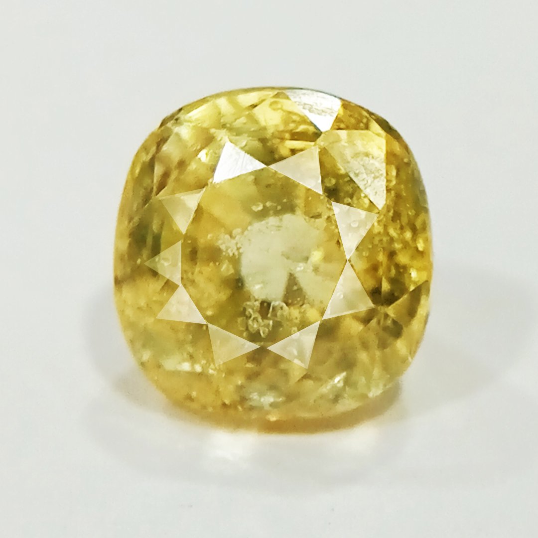 A high-quality Yellow Sapphire stone, known for its astrological benefits and association with Jupiter.