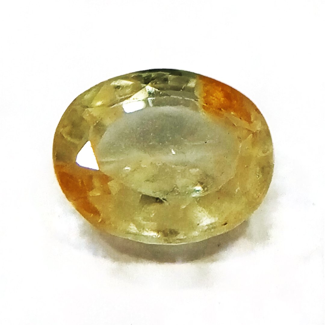 A high-quality Yellow Sapphire stone, known for its astrological benefits and association with Jupiter.