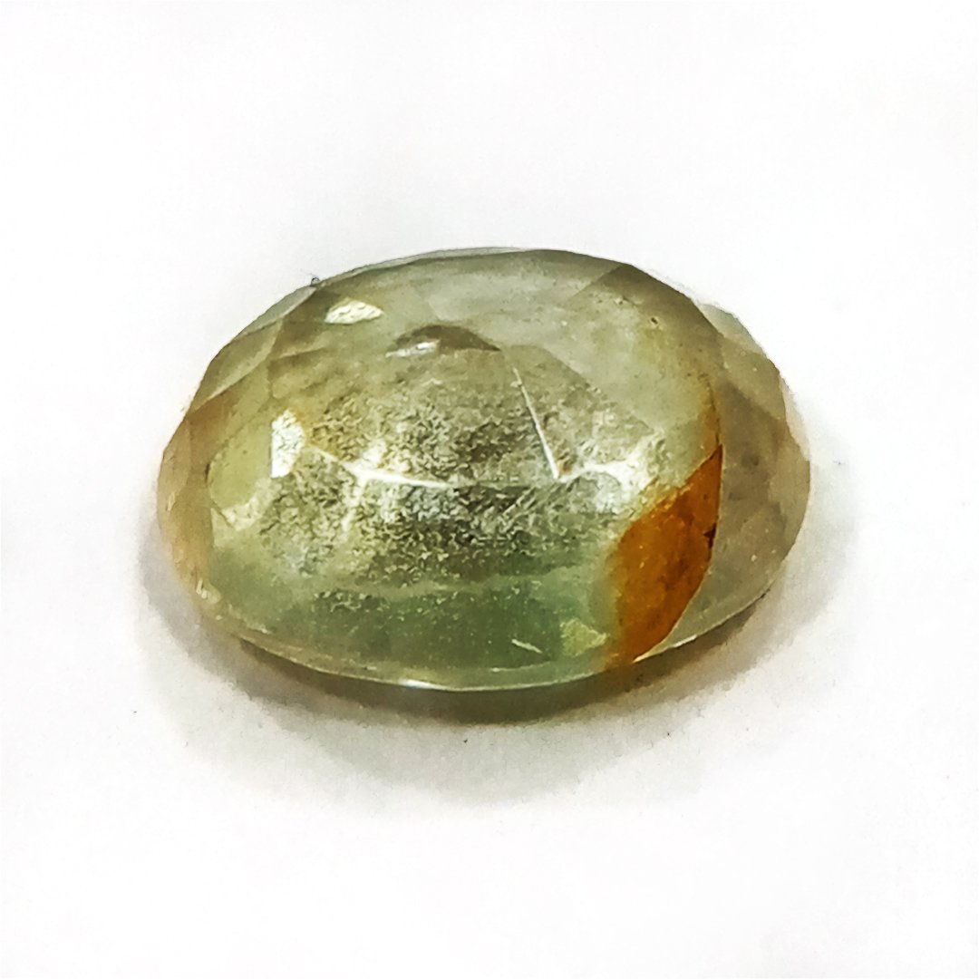 A high-quality Yellow Sapphire stone, known for its astrological benefits and association with Jupiter.