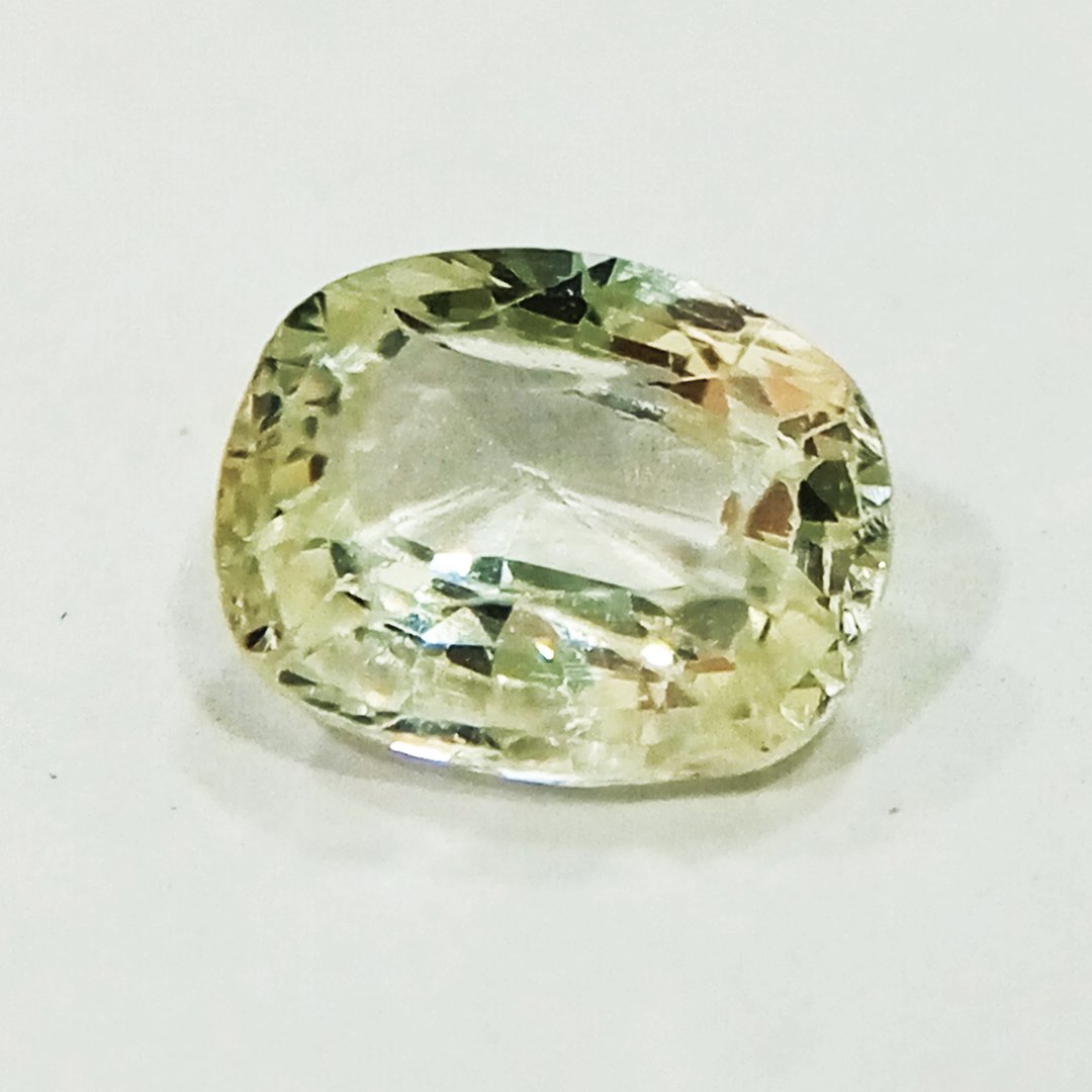 A high-quality Yellow Sapphire stone, known for its astrological benefits and association with Jupiter.