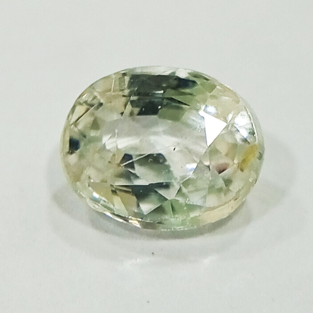 A high-quality Yellow Sapphire stone, known for its astrological benefits and association with Jupiter.