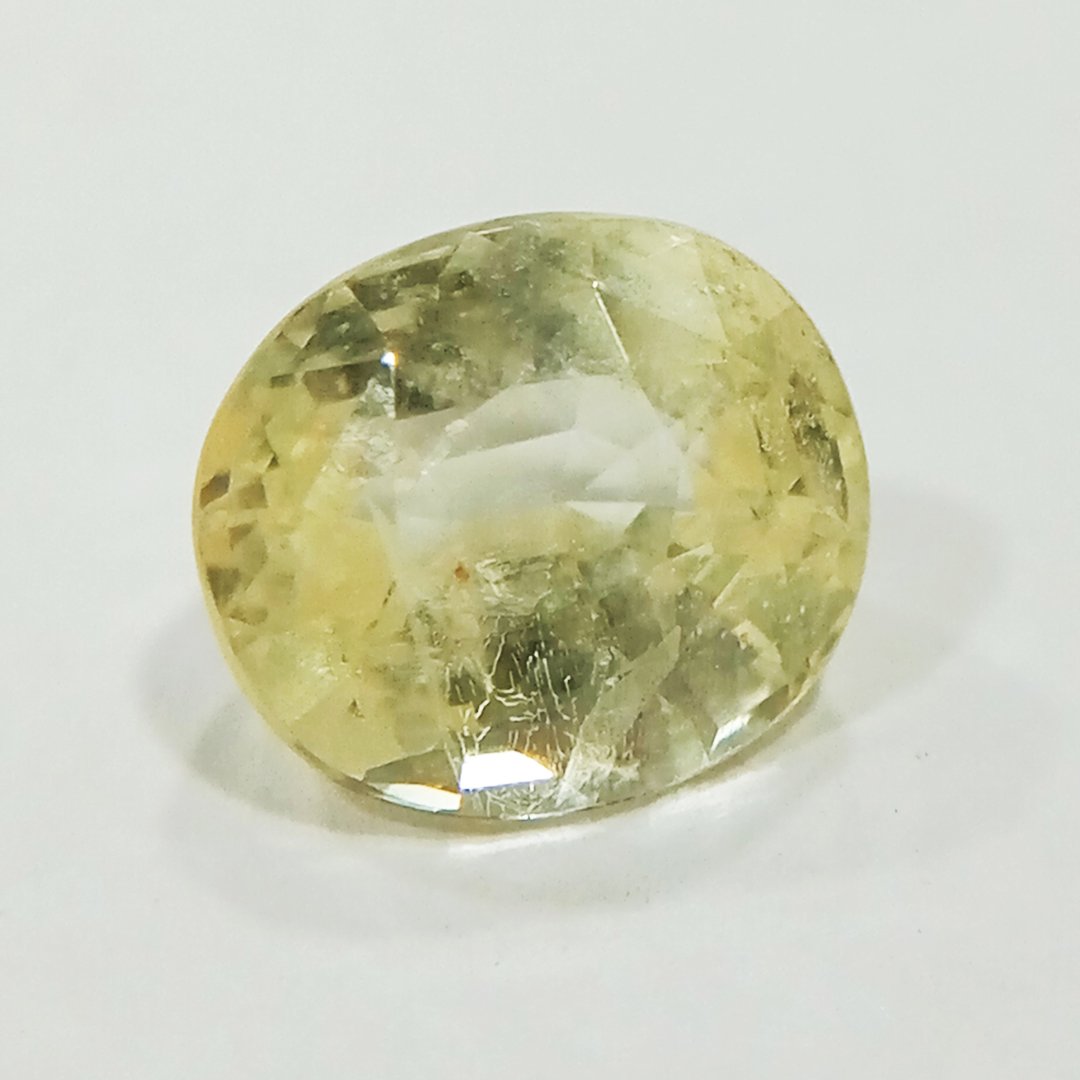 A high-quality Yellow Sapphire stone, known for its astrological benefits and association with Jupiter.