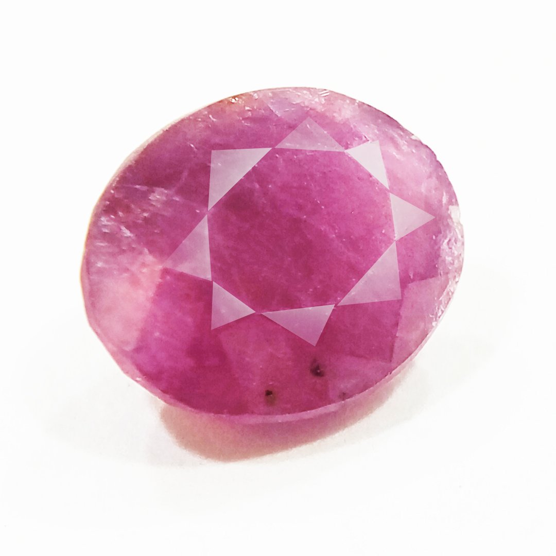 A close-up of a Natural African Ruby gemstone showcasing its rich red hue and brilliant clarity.