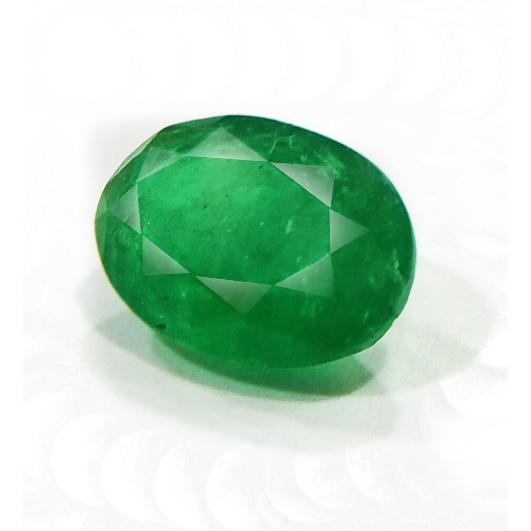 "Close-up of a radiant Zambian Emerald showcasing its vibrant green color and faceted cut."