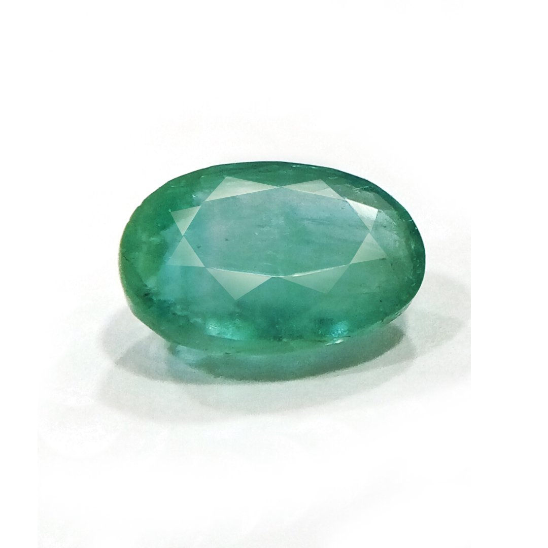 "Close-up of a radiant Zambian Emerald showcasing its vibrant green color and faceted cut."