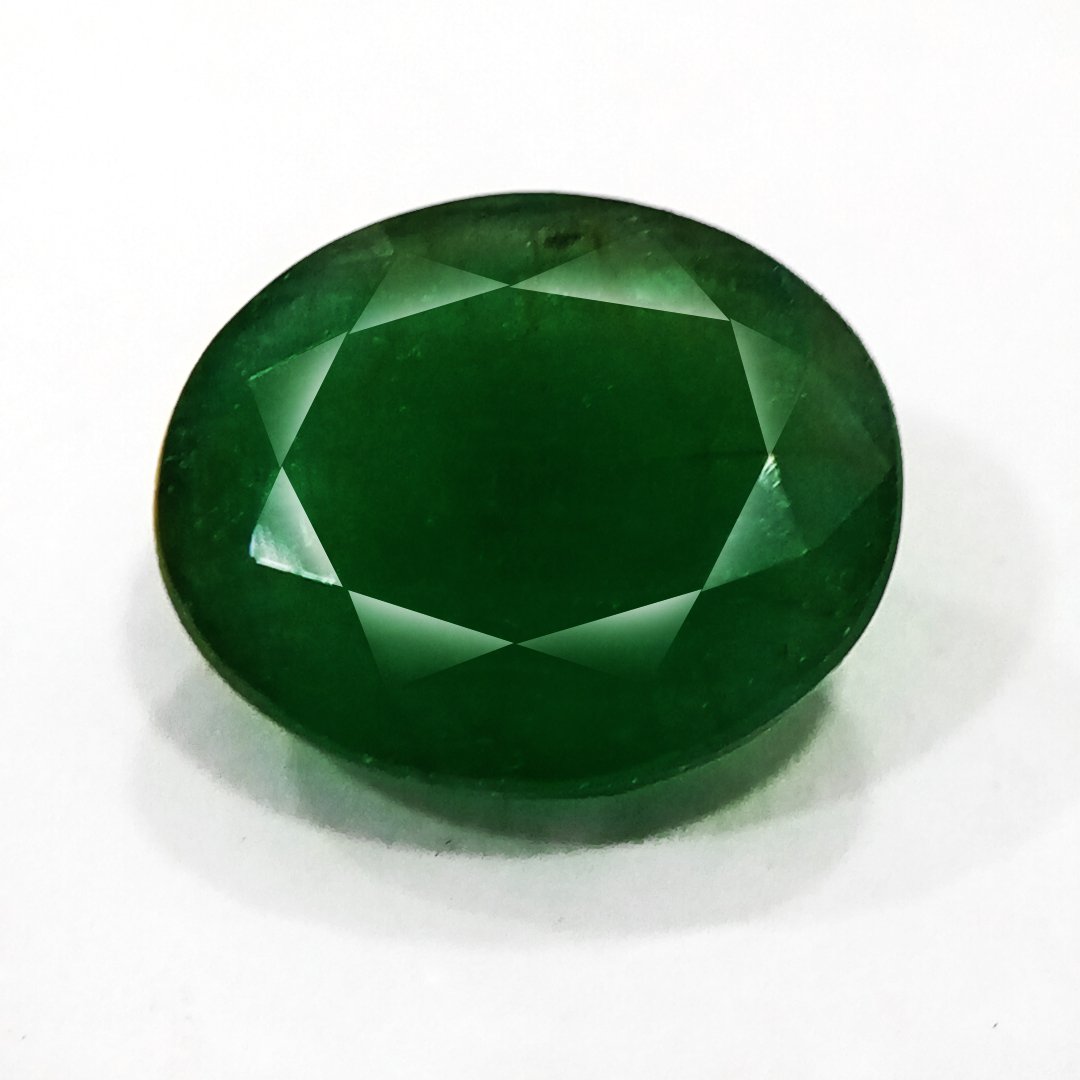 "Close-up of a radiant Zambian Emerald showcasing its vibrant green color and faceted cut."