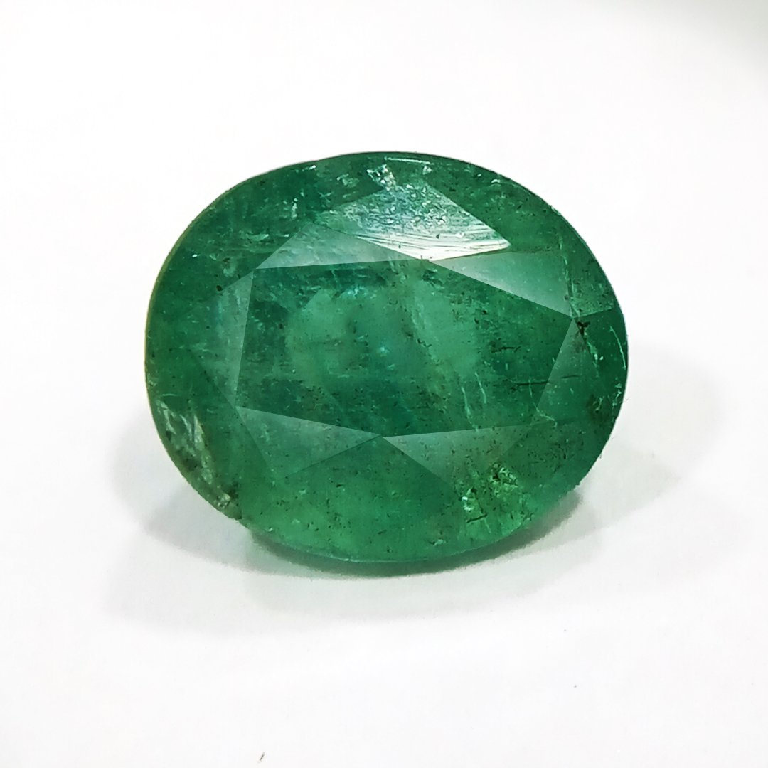 "Close-up of a radiant Zambian Emerald showcasing its vibrant green color and faceted cut."