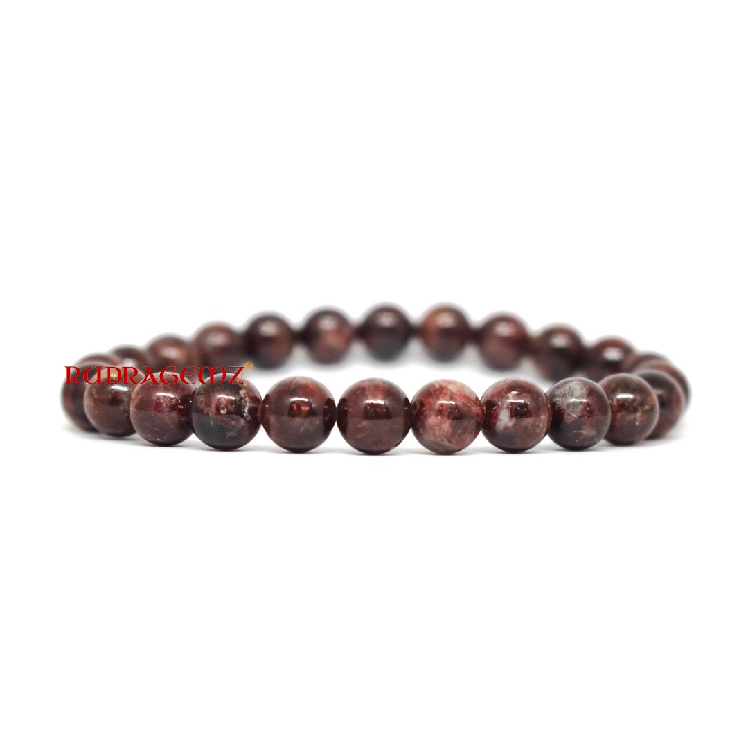 A stunning Garnet bracelet with deep red polished beads, symbolizing passion, energy, and strength.