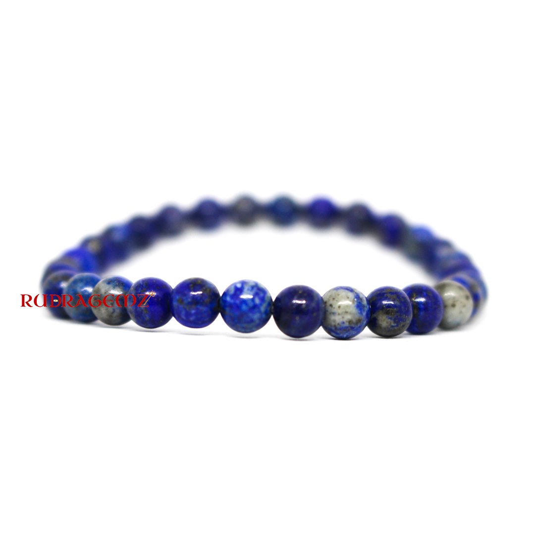: A beautifully arranged Lapis Lazuli Bracelet highlighting its royal blue color and spiritual significance.