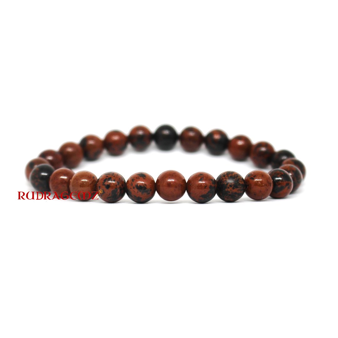 A close-up of a Mahogany Obsidian Bracelet featuring deep reddish-brown and black gemstone beads.