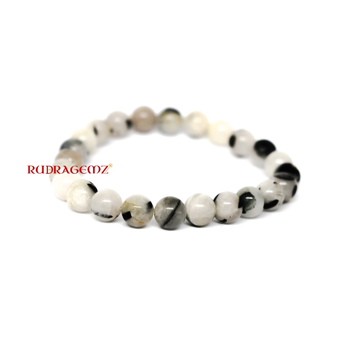 A delicately arranged Moonstone Bracelet highlighting its mystical pearlescent hues and calming energy.